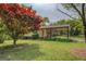 This home boasts a covered carport and lush landscaping, adding to its curb appeal at 6950 Shannon Dr, Lithia Springs, GA 30122