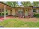 Charming home featuring a covered carport and well-kept landscaping at 6950 Shannon Dr, Lithia Springs, GA 30122