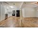 Kitchen with white cabinets and stainless steel appliances, open to the living area at 6950 Shannon Dr, Lithia Springs, GA 30122