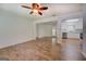 Spacious living area flows into kitchen, featuring wood look flooring and neutral paint at 6950 Shannon Dr, Lithia Springs, GA 30122