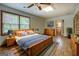 Nicely furnished main bedroom featuring hardwood floors and an en suite bathroom at 6950 Shannon Dr, Lithia Springs, GA 30122