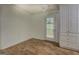 Room with wood-look flooring, neutral walls and a door that leads to a screened in porch at 6950 Shannon Dr, Lithia Springs, GA 30122
