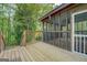 The screened porch has wood floors and railings at 6950 Shannon Dr, Lithia Springs, GA 30122