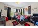 Cozy bedroom with gaming themed decor and a window letting in natural light at 634 Gardner Rd, Stockbridge, GA 30281
