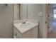 Bathroom vanity with a white sink and views into an attached bedroom at 20 Highgate Trl, Covington, GA 30016