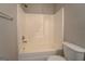 Bathtub and shower area with white tiled walls and chrome fixtures at 20 Highgate Trl, Covington, GA 30016