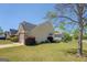 Charming home featuring a well-maintained lawn, and a convenient attached garage at 20 Highgate Trl, Covington, GA 30016