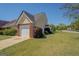 View of a single Gathering home and adjacent property, with grass and a driveway at 20 Highgate Trl, Covington, GA 30016