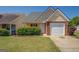 Charming single Gathering home with a one car garage and a well maintained lawn at 20 Highgate Trl, Covington, GA 30016