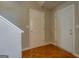 Hallway with wood flooring and white interior doors at 20 Highgate Trl, Covington, GA 30016