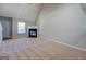 Spacious living room with fireplace and large window at 20 Highgate Trl, Covington, GA 30016