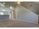 Open-concept living space with kitchen and staircase at 20 Highgate Trl, Covington, GA 30016