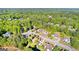 A high angle aerial view of residential area surrounded by dense forest on a sunny day at 202 Willow Rock Pt, Fayetteville, GA 30215