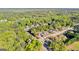 A high angle aerial view of residential area surrounded by dense forest on a sunny day at 202 Willow Rock Pt, Fayetteville, GA 30215