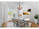 An updated dining room showcasing modern furnishings and natural lighting at 202 Willow Rock Pt, Fayetteville, GA 30215
