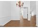 Dining room featuring a decorative chandelier and hardwood floors at 202 Willow Rock Pt, Fayetteville, GA 30215