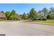 Attractive home with well-kept landscaping and verdant trees providing a tranquil and picturesque curb appeal at 202 Willow Rock Pt, Fayetteville, GA 30215