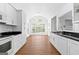 Open kitchen featuring white cabinets and stainless steel appliances at 202 Willow Rock Pt, Fayetteville, GA 30215