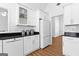 Modern kitchen features white cabinets, subway tile backsplash, and dishwasher at 202 Willow Rock Pt, Fayetteville, GA 30215
