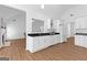 Bright eat-in kitchen featuring white cabinets and updated countertops at 202 Willow Rock Pt, Fayetteville, GA 30215