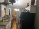 Traditional kitchen with granite countertops, white cabinets, and a view into the living room at 4379 Cross Ln, Decatur, GA 30035