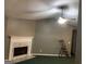 Bright living room with a marble fireplace and ceiling fan at 4379 Cross Ln, Decatur, GA 30035