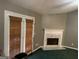 Inviting living room features a fireplace and doors leading to the backyard at 4379 Cross Ln, Decatur, GA 30035