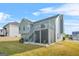 Expansive backyard with a deck, screened in patio and stairs leading to the yard at 736 Mesa Rd, Mcdonough, GA 30253