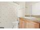 Clean bathroom with a shower-tub combo, neutral-toned vanity, and a framed mirror above the sink at 736 Mesa Rd, Mcdonough, GA 30253