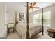 Inviting bedroom with a four-poster bed, neutral tones, and a ceiling fan for added comfort at 736 Mesa Rd, Mcdonough, GA 30253