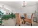 Bright dining area featuring a round glass table, stylish woven chairs, and plenty of natural light at 736 Mesa Rd, Mcdonough, GA 30253