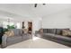 Comfortable living room with grey sofas and a view to an adjacent room at 736 Mesa Rd, Mcdonough, GA 30253