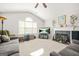 Inviting living room with vaulted ceilings, a fireplace, and cozy seating arrangement at 736 Mesa Rd, Mcdonough, GA 30253