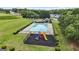 Community pool and playground featuring lounge chairs and gazebo in a well-maintained green space at 736 Mesa Rd, Mcdonough, GA 30253