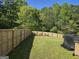 Large backyard includes privacy fence, ample green space, and storage at 1055 Field View Dr, Mcdonough, GA 30253