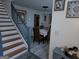 Elegant dining room visible from the staircase, featuring a table setting for six at 1055 Field View Dr, Mcdonough, GA 30253
