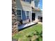 Landscaped exterior features lovely stone accents, white gravel, and stylish potted plants at 1055 Field View Dr, Mcdonough, GA 30253