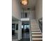 Open foyer features soaring ceilings, stylish staircase, and elegant lighting at 1055 Field View Dr, Mcdonough, GA 30253