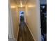 Hallway with wood floors and light walls at 1055 Field View Dr, Mcdonough, GA 30253