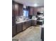 The kitchen has light countertops, wood cabinets and stainless appliances at 1055 Field View Dr, Mcdonough, GA 30253