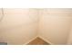 Walk-in closet space with basic wire shelving and neutral colored walls at 223 Ferndale Dr # 114, Fairburn, GA 30213