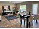 Bright living room with dining area boasts stylish furnishings and plenty of natural light at 223 Ferndale Dr # 114, Fairburn, GA 30213