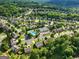 Spacious homes in a lush, green community with mature trees and a community pool and tennis courts at 340 Hammersmith Dr, Suwanee, GA 30024