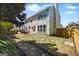 Spacious backyard featuring a well-manicured lawn, patio area, and a stone pathway at 340 Hammersmith Dr, Suwanee, GA 30024