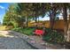 Serene backyard featuring a charming swing and a stone path winding through lush greenery at 340 Hammersmith Dr, Suwanee, GA 30024
