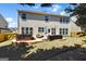 Expansive backyard featuring a patio, hot tub, lush lawn, and well-maintained landscaping at 340 Hammersmith Dr, Suwanee, GA 30024