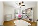 Inviting bedroom with bookshelves and a comfortable chair at 340 Hammersmith Dr, Suwanee, GA 30024
