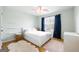 Cozy bedroom with a plush rug and bright natural light at 340 Hammersmith Dr, Suwanee, GA 30024