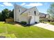 Charming home featuring a two-car garage, well-maintained lawn and beautiful landscaping at 340 Hammersmith Dr, Suwanee, GA 30024