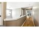 Bright upstairs hallway with a craftsman-style railing overlooking the entry at 340 Hammersmith Dr, Suwanee, GA 30024